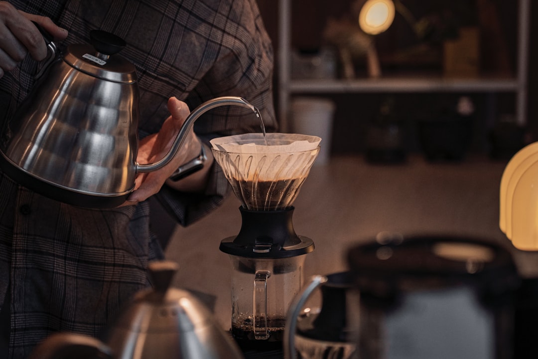 Someone is brewing coffee with a pour-over method